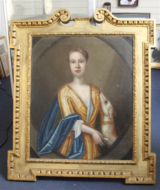 After Sir Godfrey Kneller Half length portrait of a young man with rearing dog 30 x 24.5in.